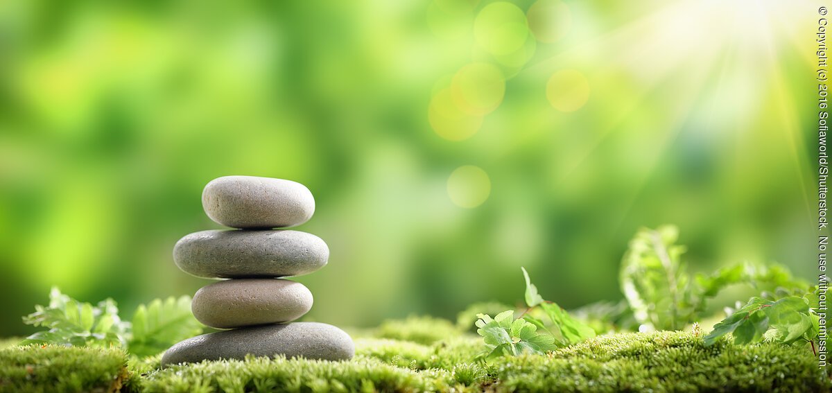 Stack of zen stones on nature background